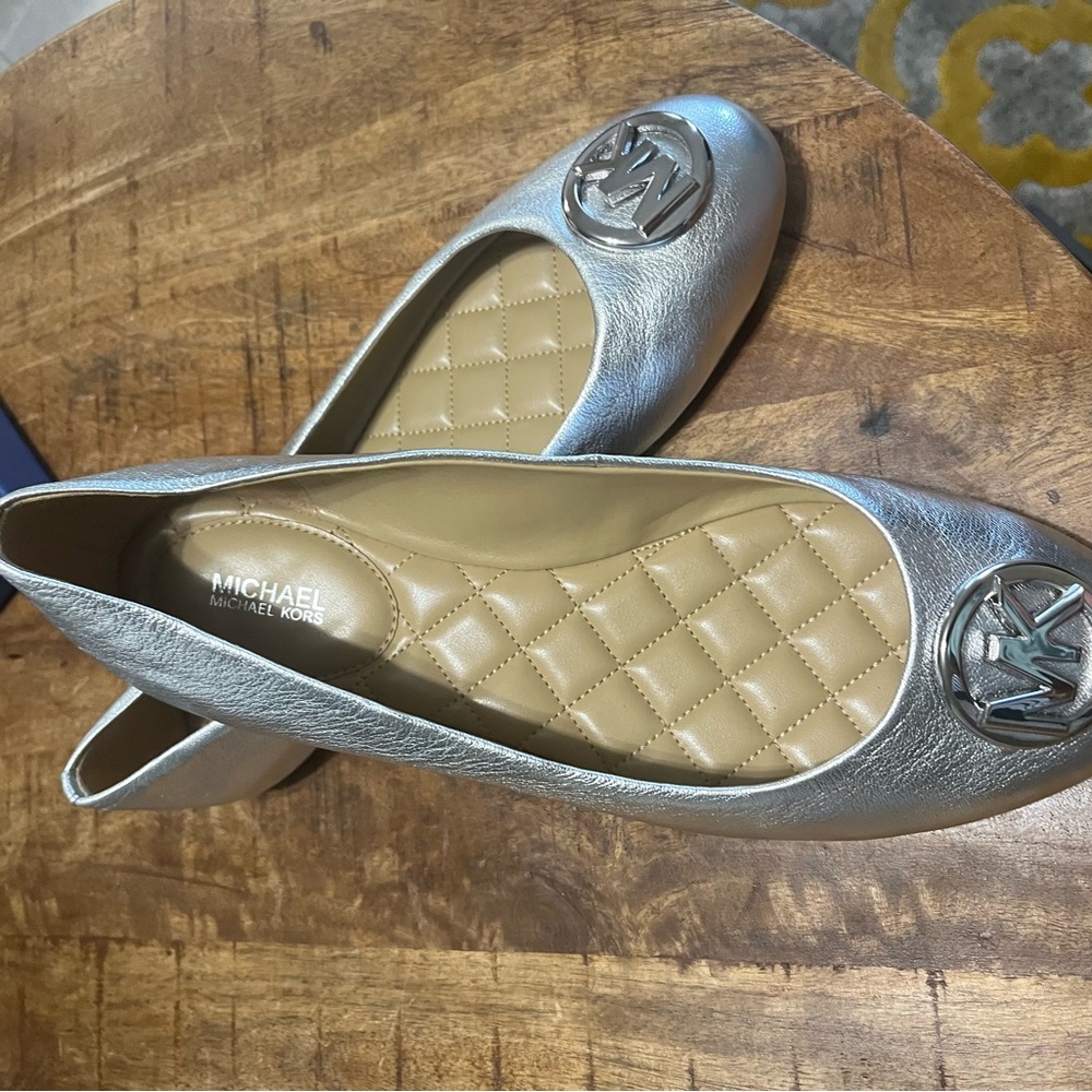 Michael Kors gently worn flats. Silver with plush insole. Size 11.